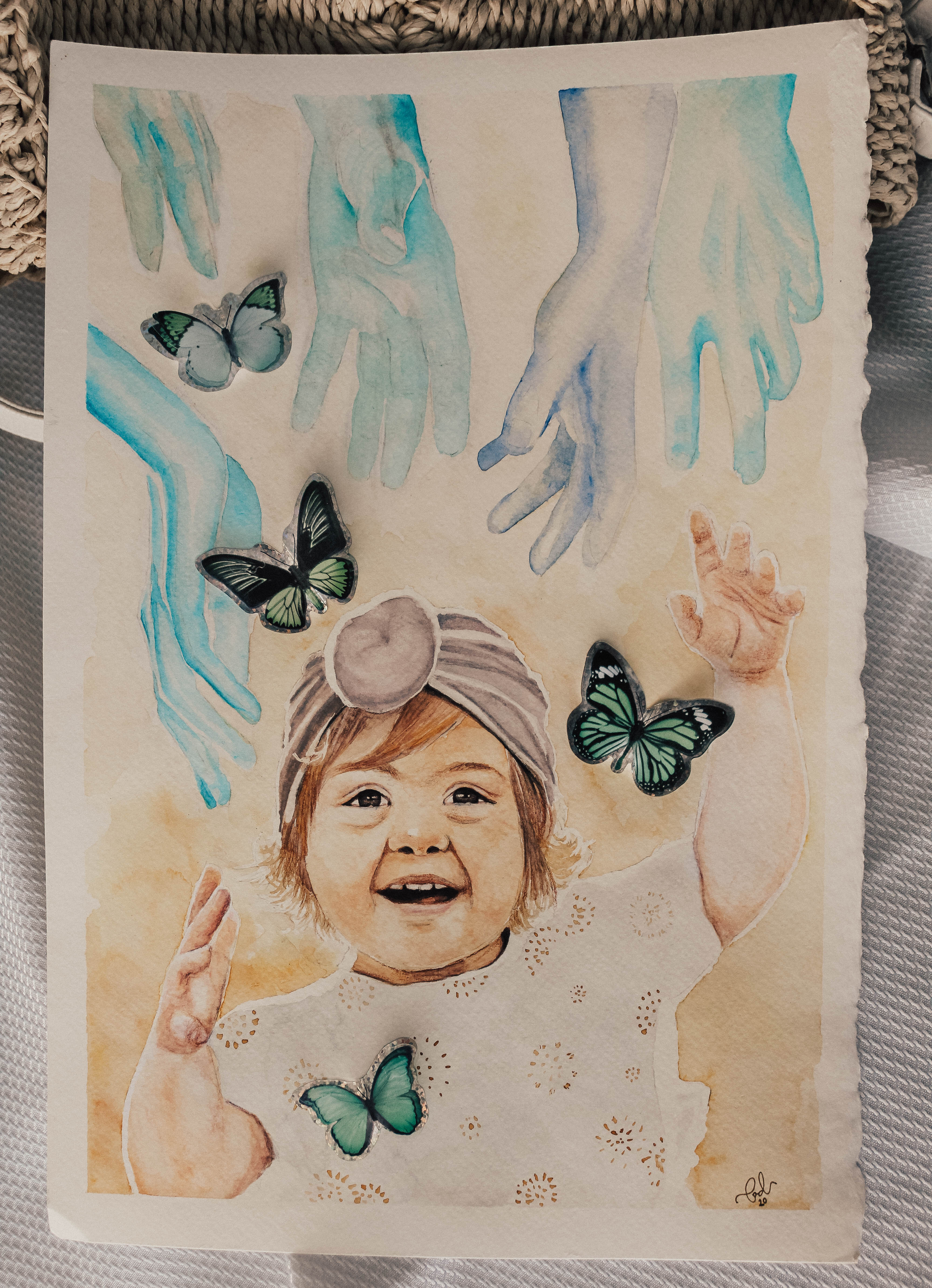 Baby reaching toward butterflies